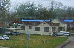 Blue tarps on roofs